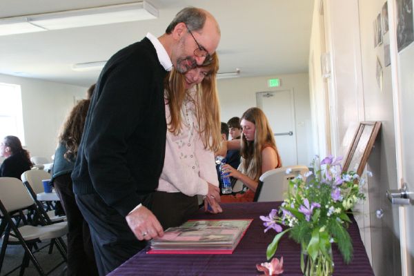 Ed and Laura looking at photo albums