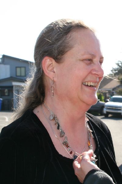 Caren showing off Mom's charm necklace